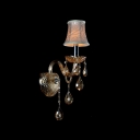Sparkling Single Light Wall Sconce Features Beautiful Scrolling Arms and Crystal Drops Topped with Grey Fabric Shade