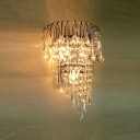 Shimmering Strands of Clear Crystal Hang From Wall Sconce with Graceful Gold Scrolls