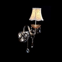 Sleek Scrolling Arm and Clear Crystal Formed Graceful Single Light Wall Sconce