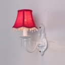 Bold Red Fabric Shade and Elegant White Finish Add Charm to Graceful Single Light Wall Sconce Perfect for Feminine Room