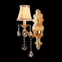 Elaborate Crystal Accent Single Light Wall Sconce Offers Decorative Gold Detailing and White Fabric Bell Shade