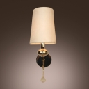Elegant Wrought Iron Wall Sconce Features White Fabric Shade and Clear Crystal Drop