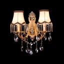 Luxury Two Light Wall Sconce Features Beige Fabric Bell Shades Trimmed with Tassels
