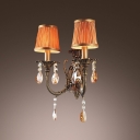 Brautiful Wrought Iron Arms and Orange Fabric Shades Creates Stunning Wall Sconce