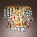 Decadent Wall Sconce Features Gold Finish and Strand of  Crystal Beads