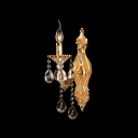 Delicate Polished Gold Finish and Beautiful Crystal Droplets Add Luxury to Gleaming One-light Wall Sconce