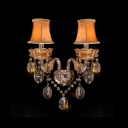 Lustrous Double Light Wall Sconce with Graceful Curving Arms and Clear Crystal Drops