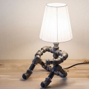 Industrial Sitting Robot Table Lamp in Black/Antique Brozne Finish with Fabric Shade