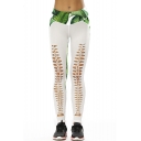 Fashionable Leaf Printed Color Block Hollow Out Skinny Leggings