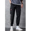 Guys Trendy Camouflage Patched Flap Pocket Side Drawstring Waist Casual Loose Sports Cargo Pants