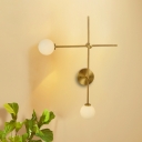 Modernist 2-Light Wall Mount Lamp Metal Golden Crossed Sconce Light Fixture with Closed Glass Shade
