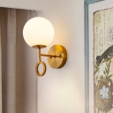 Modernism Ball Wall Sconce Cream Glass 1-Light Bedside Wall Mount Lamp Fixture in Brass