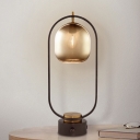 Minimalism Oval Night Light Amber Glass 1 Light Bedroom Nightstand Lighting in Black with Metal Frame