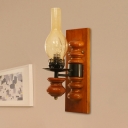 Coastal Kerosene Wall Lighting 1 Bulb Clear Hand Blown Glass Sconce with Wood Backplate in Red Brown