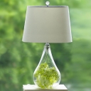 Clear Glass Teardrop Table Lamp Rural 1 Head Bedroom Nightstand Light with Fabric Shade and Green Fake Flower