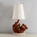Brown Doggy Nightstand Lamp Lodge Resin 1 Head Bedside Table Light with Deep Cone Fabric Shade