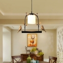 Designer Cylinder Milk Glass Hanging Lamp 1 Bulb Ceiling Pendant with Arched Frame and Bird Decoration in Black
