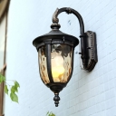 Lodge Arched Arm Wall Lighting 1-Head Amber Dimple Glass Sconce Light Fixture in Black