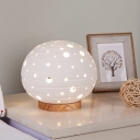 Hollowed Out Ovoid Mini Night Lamp Simple Ceramic Single White Table Light with Wood Base