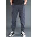 Trendy Men's Pants Plain Cuffed Drawstring Waist Tapered Fit Full Length Cargo Pants with Flap Pockets