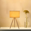 Cylindrical Night Stand Light Minimalist Fabric 1 Bulb Beige Table Lamp with Wooden Tri-Leg