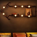 Wrought Iron Arrow Shaped Pipe Sconce Industrial 8 Lights Living Room Wall Lamp in Black/Copper with Rack Function