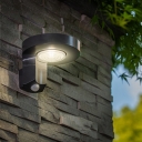 Plastic Round Solar Wall Lamp Simple Style Black LED Sconce Lighting for Outdoor