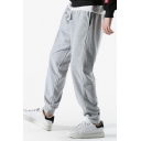 Men Sportive Pants Solid Color Drawstring Mid-Rise Pocket Detail Long Loose Fit Jogger Pants