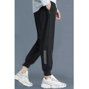 Men Sporty Pants Stripe Print Zip Pocket Drawstring Waist Long Loose Sweatpants in Black