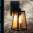 Industrial Trapezoid Wall Light with Clear Glass Shade Wrought Iron Frame Single Light Wall Sconce in Black