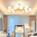 Elegant Brass Chandelier with White Glass Shades and Modern Globe Design
