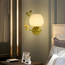 Modern Green Glass Wall Sconce with Frosted Shade and Ambient Lighting