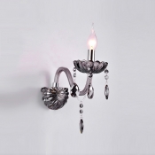 Elegant Single Light Crystal Wall Sconce with Delicate Back Plate and Graceful Curving Arm