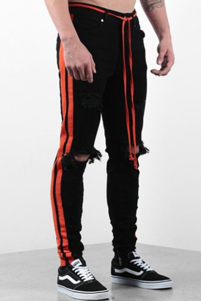 orange ripped jeans mens