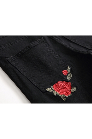 black ripped jeans with roses