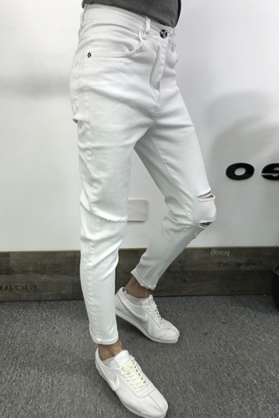 knee cut white jeans