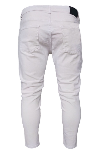 knee cut white jeans