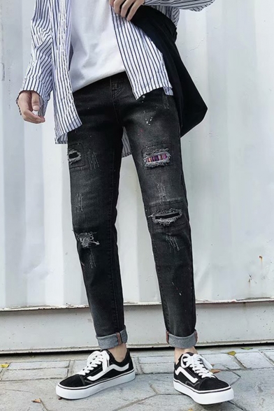 ripped jeans with plaid patches