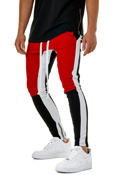 white track pants with red stripe