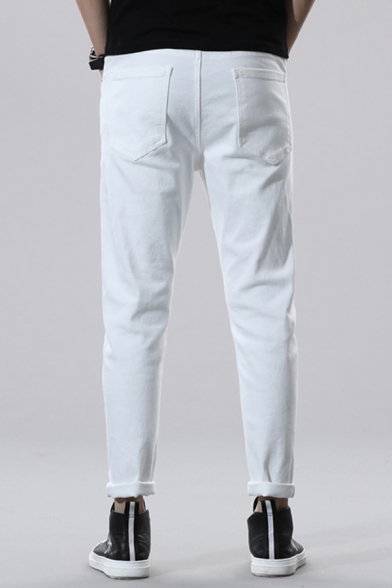 mens white tapered jeans