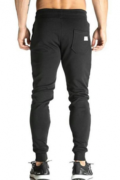 Men Sporty Drawstring Pants Solid Color Pocket Detail Skinny Fit Mid Rise Full Length Track Pants