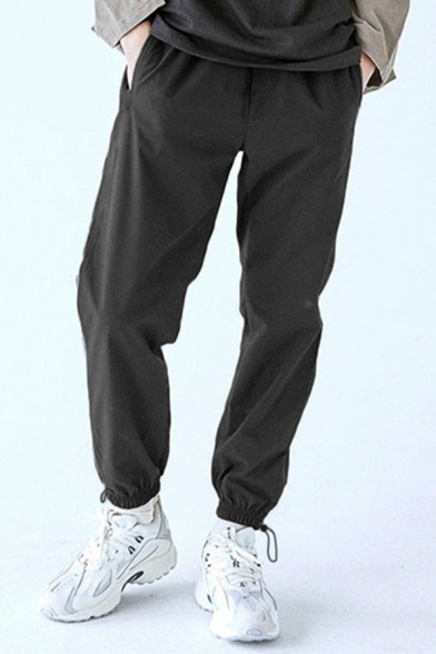 Men Casual Pants Solid Color Elastic Waist Mid-Rise Drawstring Cuffs Pocket Detail Regular Pants