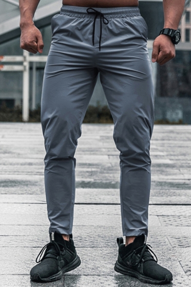 Men Sporty Pants Solid Color Elastic Waist Mid-Rise Front Pocket Full Length Regular Pants