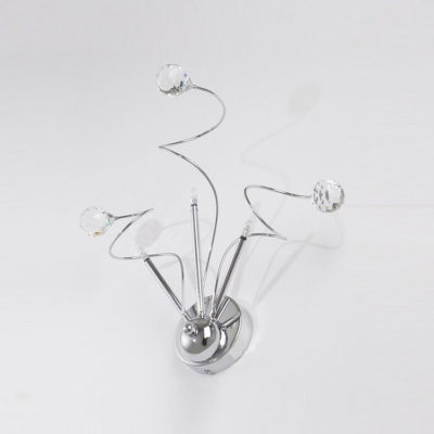 Decorative Wall Sconce Featuring Dramatic Accents of  Sleek Scrolls and Clear Crystal