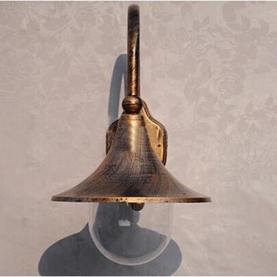 Industrial Wall Sconce with Clear Glass Shade in Aged Brass Finish