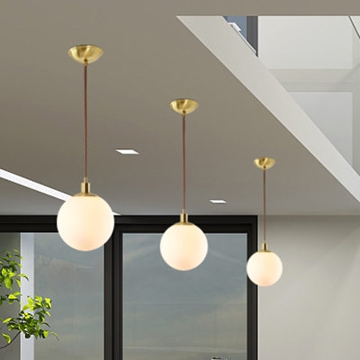 Globe Hanging Lamp Modern Fashion Milky Glass Pendant Light in Brass for Living Room