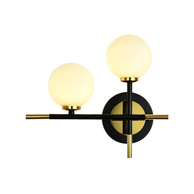 Milk Glass Orb Sconce Light with Cross Design 2 Lights Modern Black and Brass Wall Light