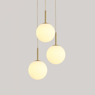 3 Heads Dining Room Hanging Lighting Modernist Brass Cluster Pendant Lamp with Ball Cream Glass Shade