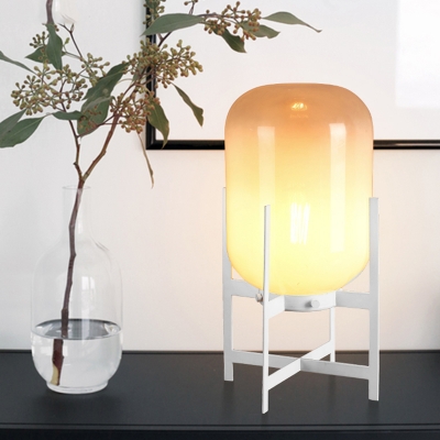 Quadruped Metal Table Light Minimalist 1-Head White/Black Finish Night Lamp with Oval Tan Glass Shade