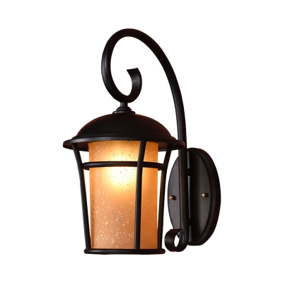 Amber Glass Cylinder Wall Lamp Rustic Outdoor Wall Mounted Light in Black with Metal Cage